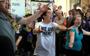 A group of people are dancing in a crowd.