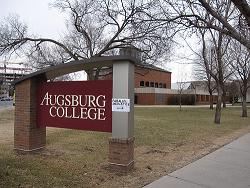 A sign that reads albertsburg college in front of a building.