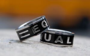 Two rings with the word equal on them.