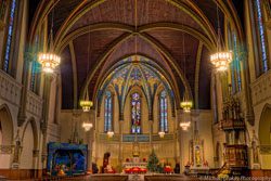 The interior of a church with stained glass windows.