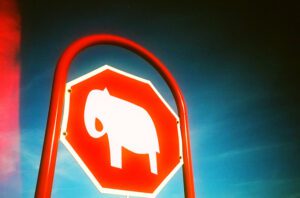 A stop sign with an elephant on it.