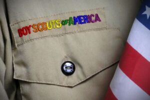 A boy scout's uniform with the words boy scouts of america on it.