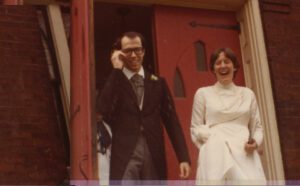 A man in a suit and a woman in a dress.