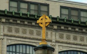 A golden cross on top of a building.