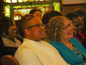 A group of people sitting in a church.