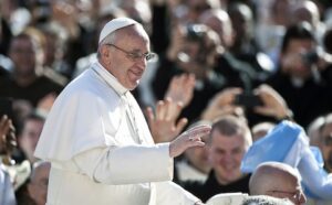 Pope john paul ii waves to the crowd.