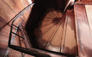 A spiral staircase in a wooden building.