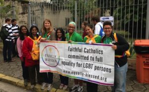 A group of people holding a banner that says faith catholics committed equality for gbt persons.