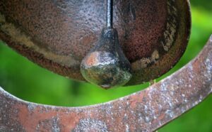 A close up of a rusty metal object.