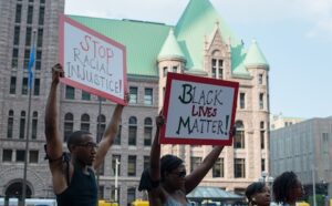 A group of people holding signs.