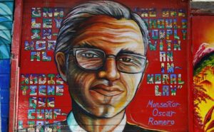A mural of a man with glasses on a wall.
