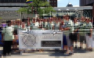 A group of people posing in front of a banner.