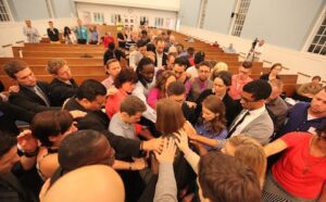 A large group of people gathered in a church.