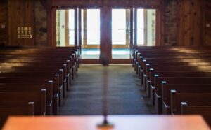 Empty wooden pews in a church.