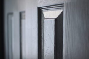 A close up view of a door with a black finish.