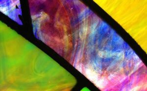 A close up of a colorful stained glass window.
