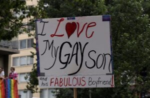 A sign that says i love my gay son.