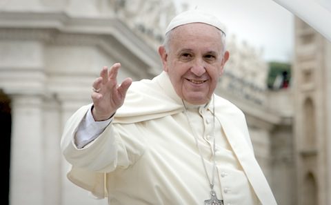 Pope francis waves to the crowd at the vatican.