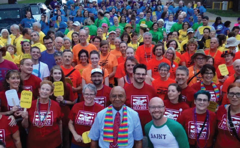 A group of people in colorful shirts posing for a photo.