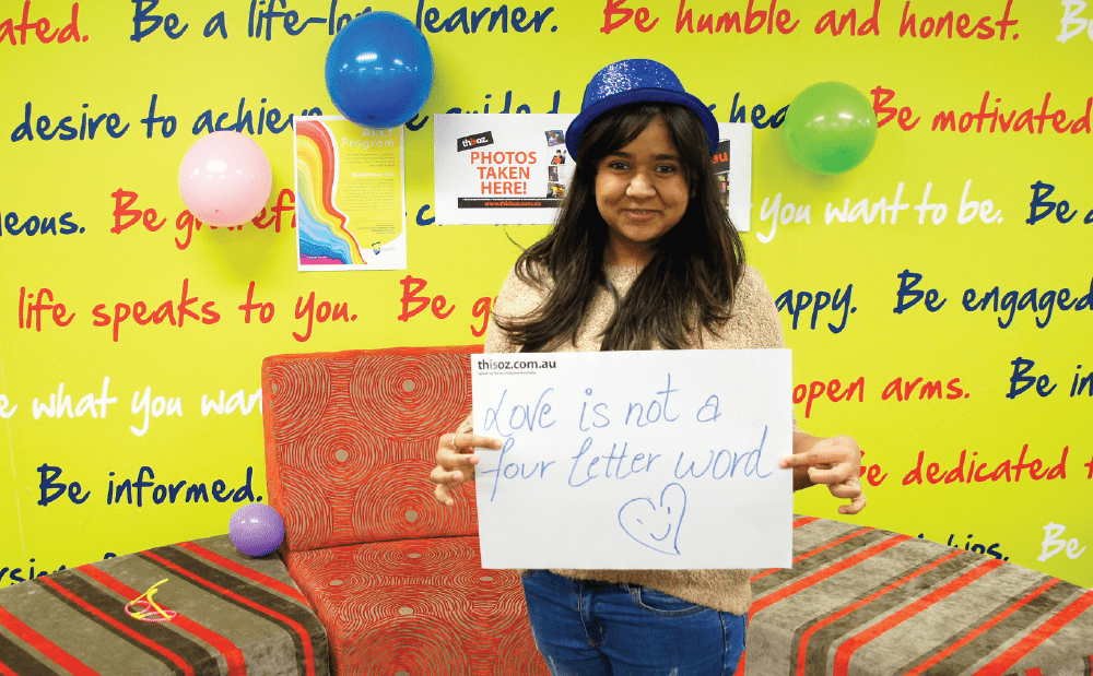 A woman holding a sign.