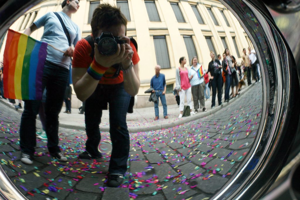 A man is taking a picture of confetti.