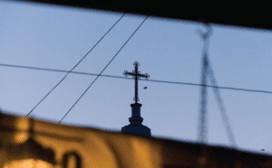 A cross on top of a building.