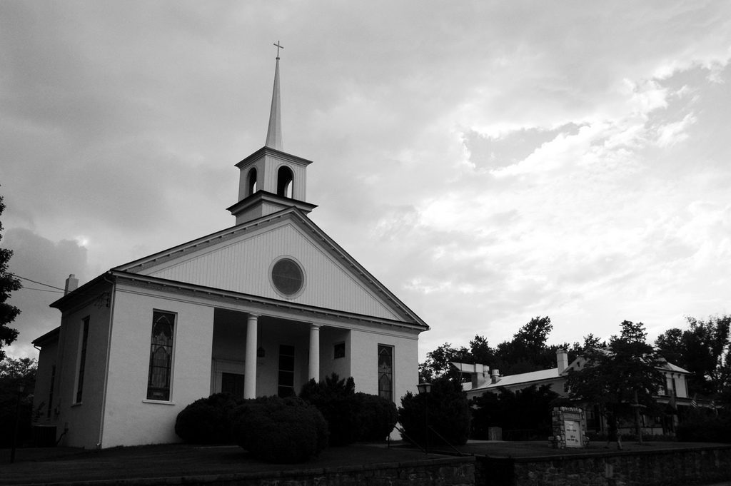 A black and white photograph of a church.