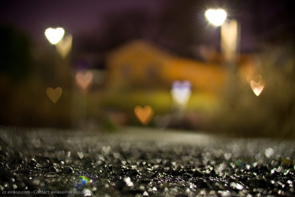 A blurry image of a street at night.