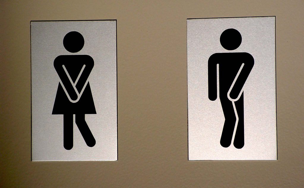 A toilet sign showing a man and a woman.