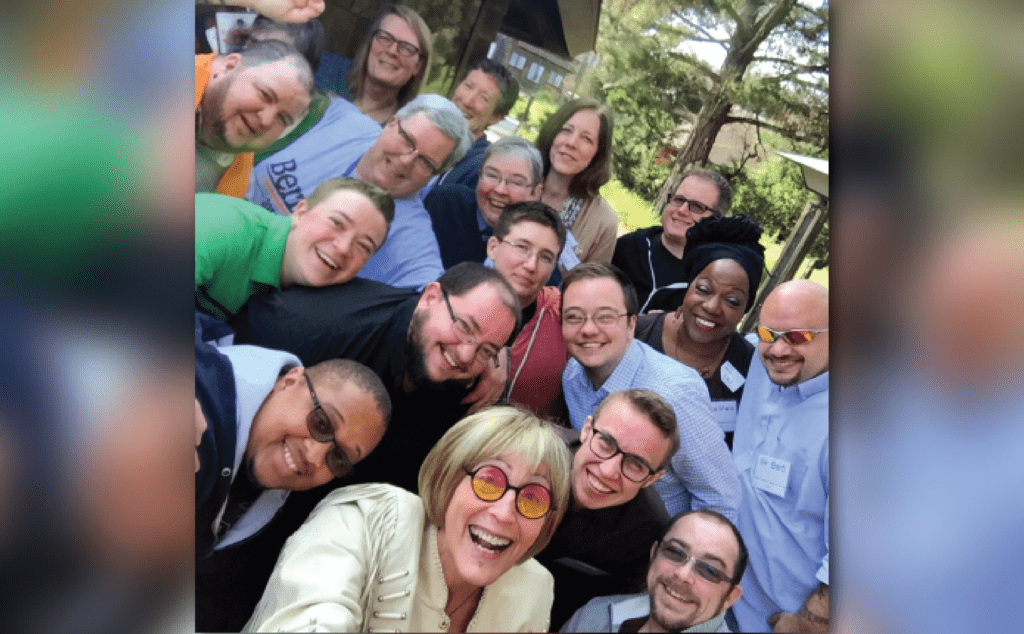 A group of people posing for a selfie.