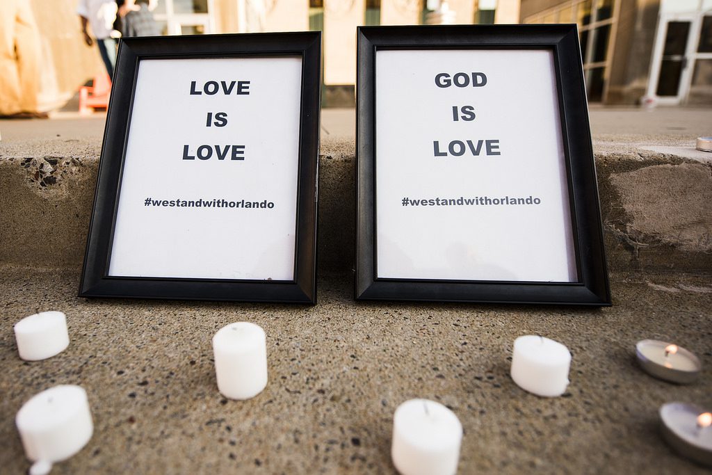 Two framed signs that say god is love.