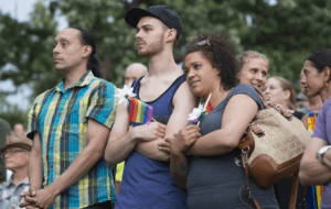 A group of people standing in a crowd.