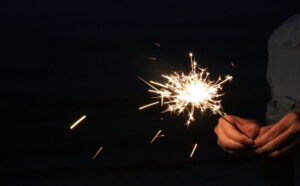 A person holding a sparkler.