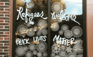 Refugees welcome black lives matter window decal.