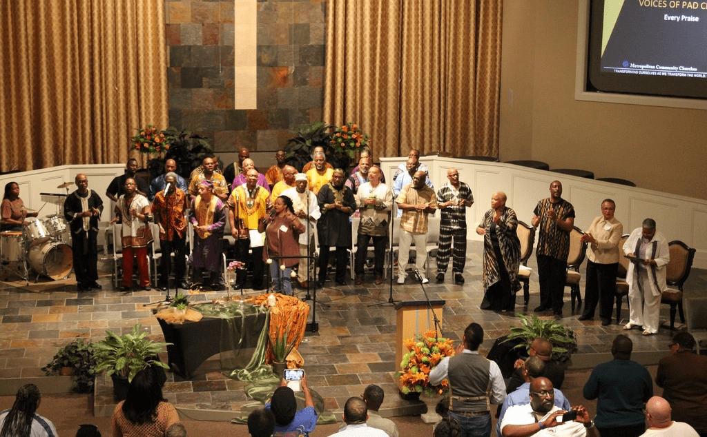 A group of people standing in a church.