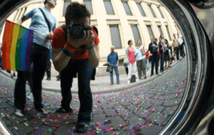 A person taking a picture of confetti.