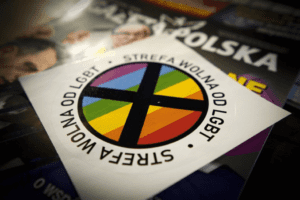 A sticker with the word lgbt on it sits on top of a magazine.
