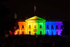 The white house is lit up in rainbow colors.