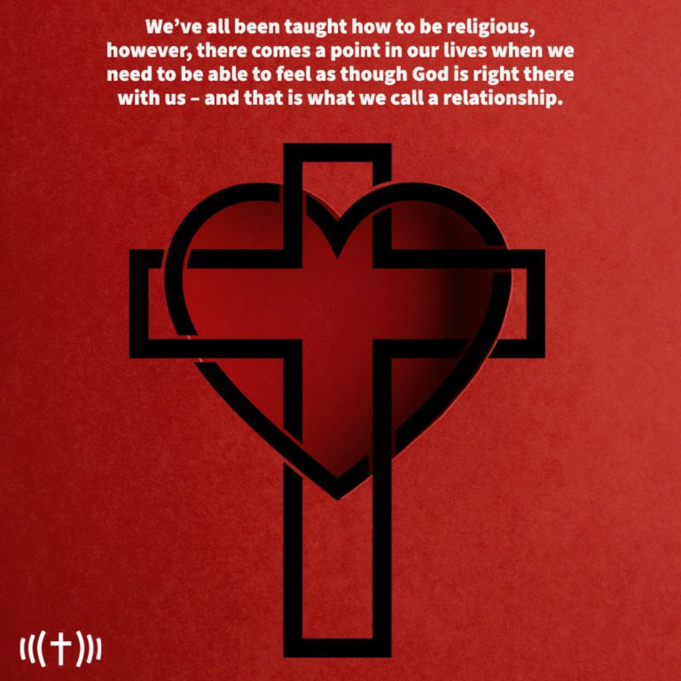 Black cross formed by negative space in a red heart.