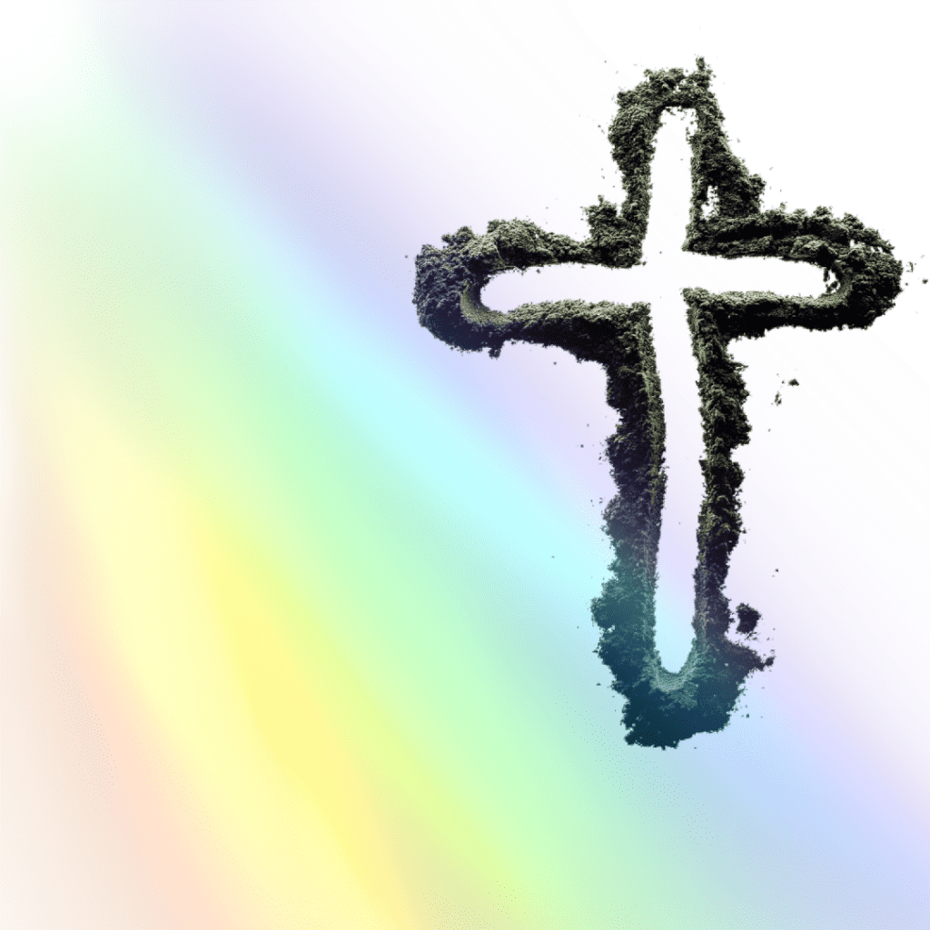 A cross made of sand on a rainbow background.