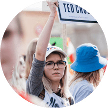 Woman holding up a protest sign